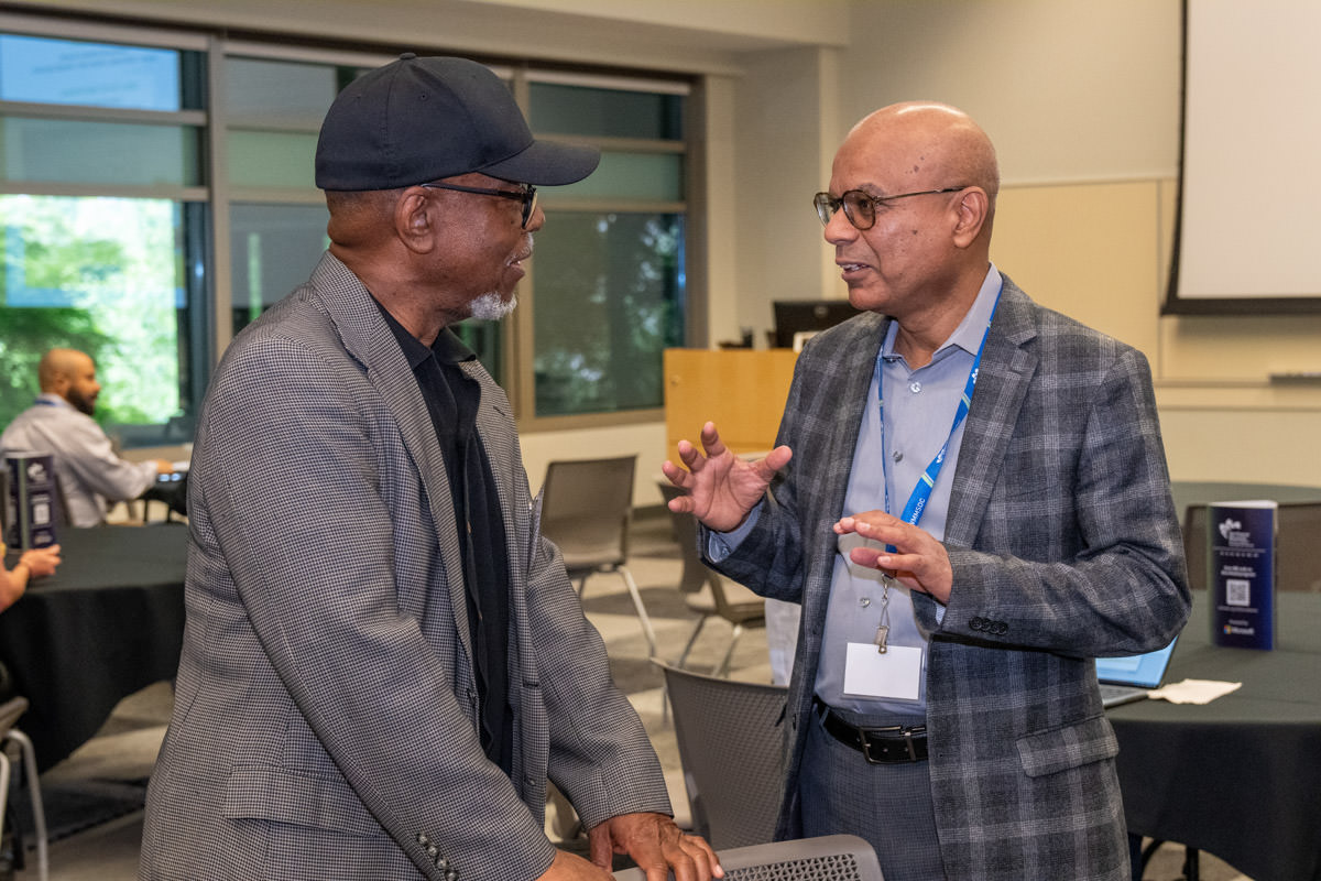 Happy latin architect holding blueprints