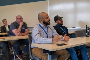 Business owners learn in a classroom.